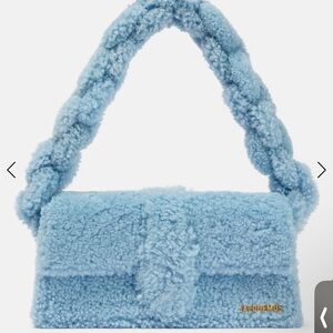 Jacquemus' classic bag silhouettes, the Le Bambidou shoulder bag in blue